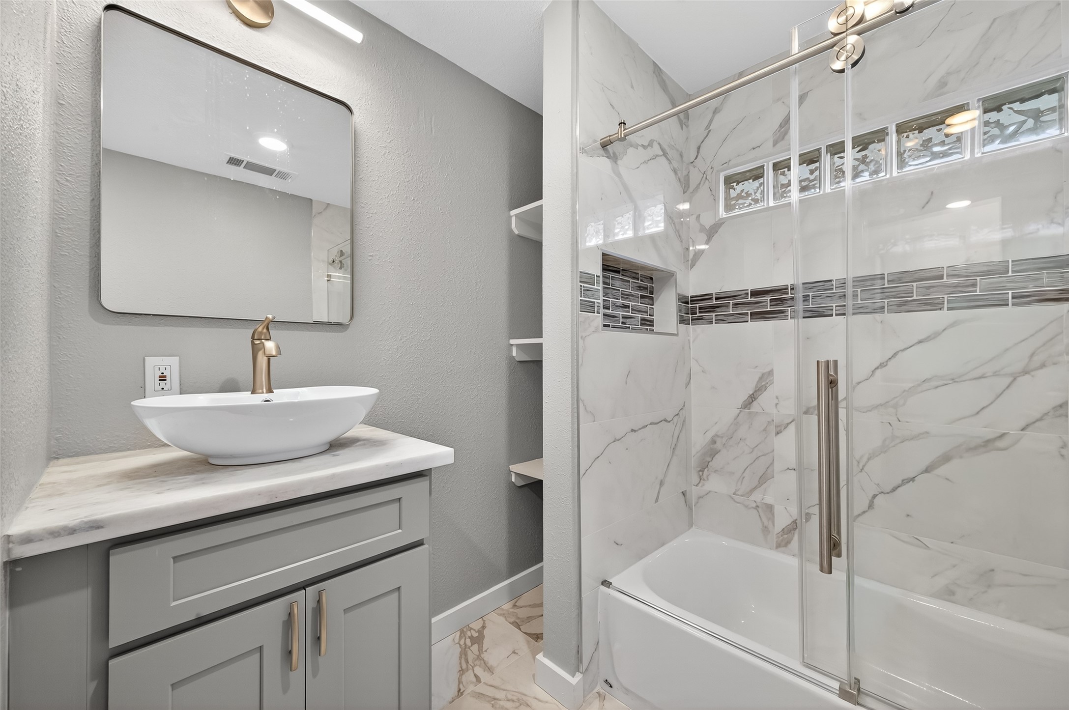 1933 Santa Rosa Street Houston, TX 77023 - Photo 30 of 44 a bathroom with a bathtub a sink a vanity and a shower