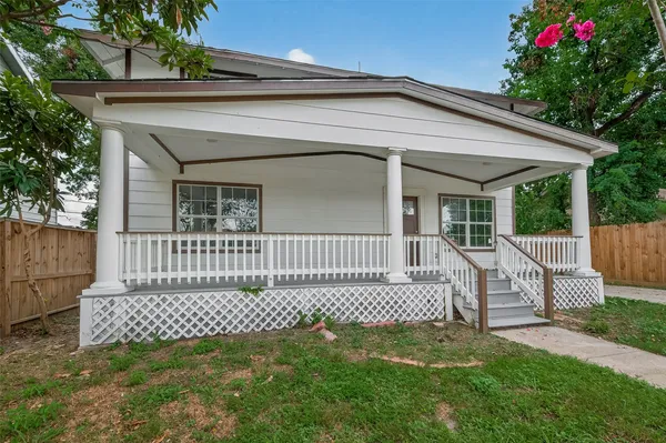 a view of a house with a small yard