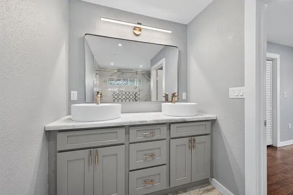 a bathroom with a sink and a mirror