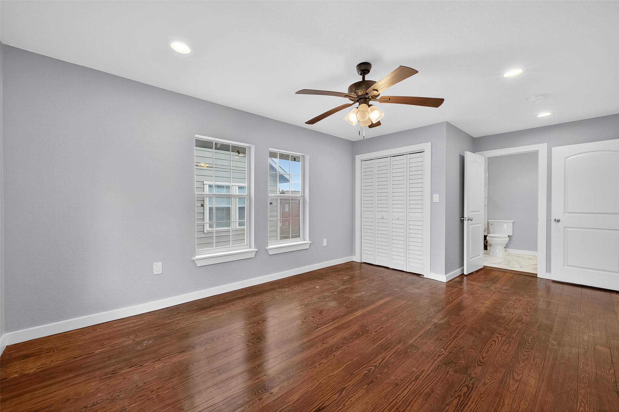 1933 Santa Rosa Street Houston, TX 77023 - Photo 34 of 44 a view of an empty room with a window and wooden floor