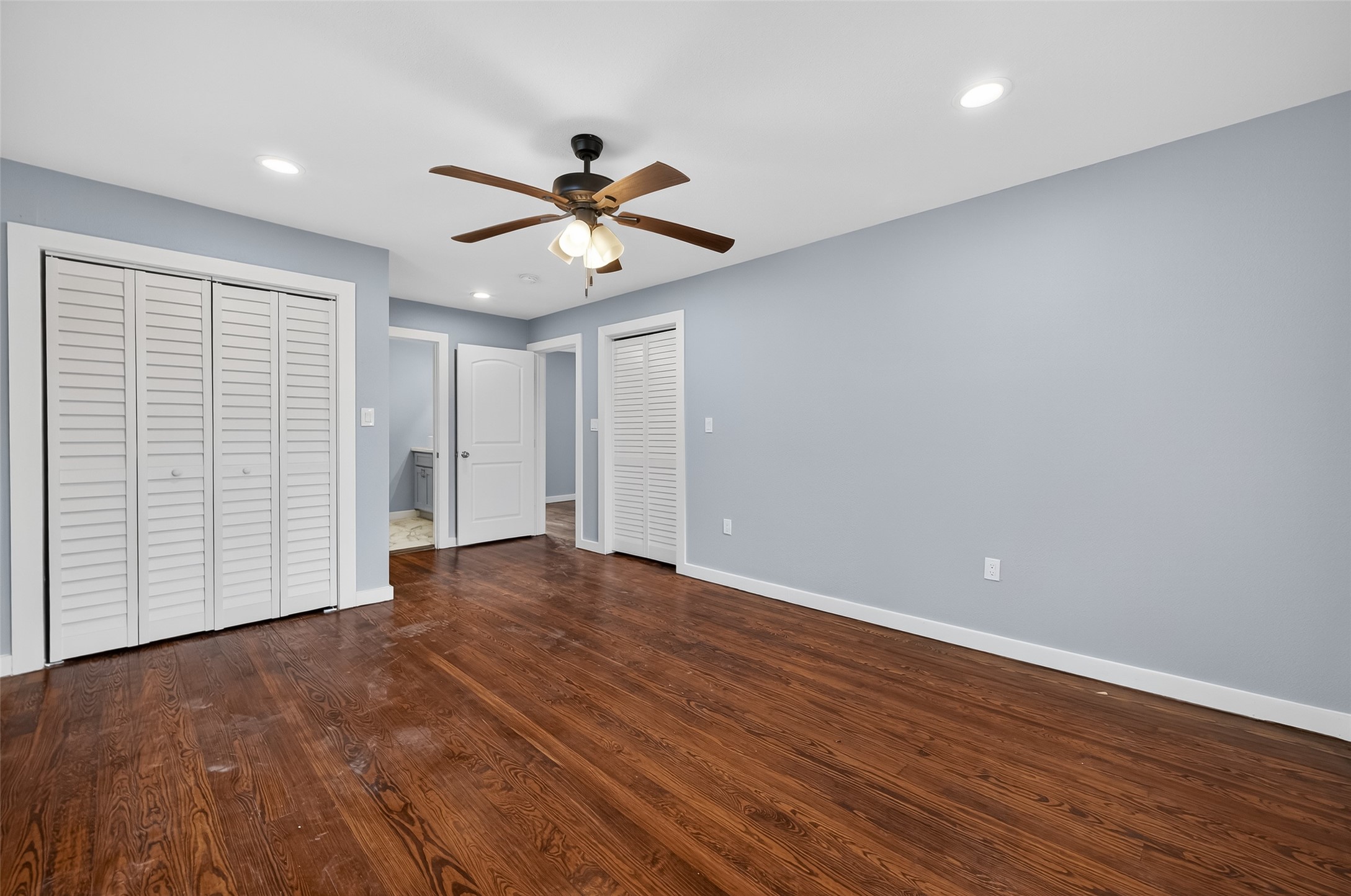 1933 Santa Rosa Street Houston, TX 77023 - Photo 35 of 44 an empty room with wooden floor and windows