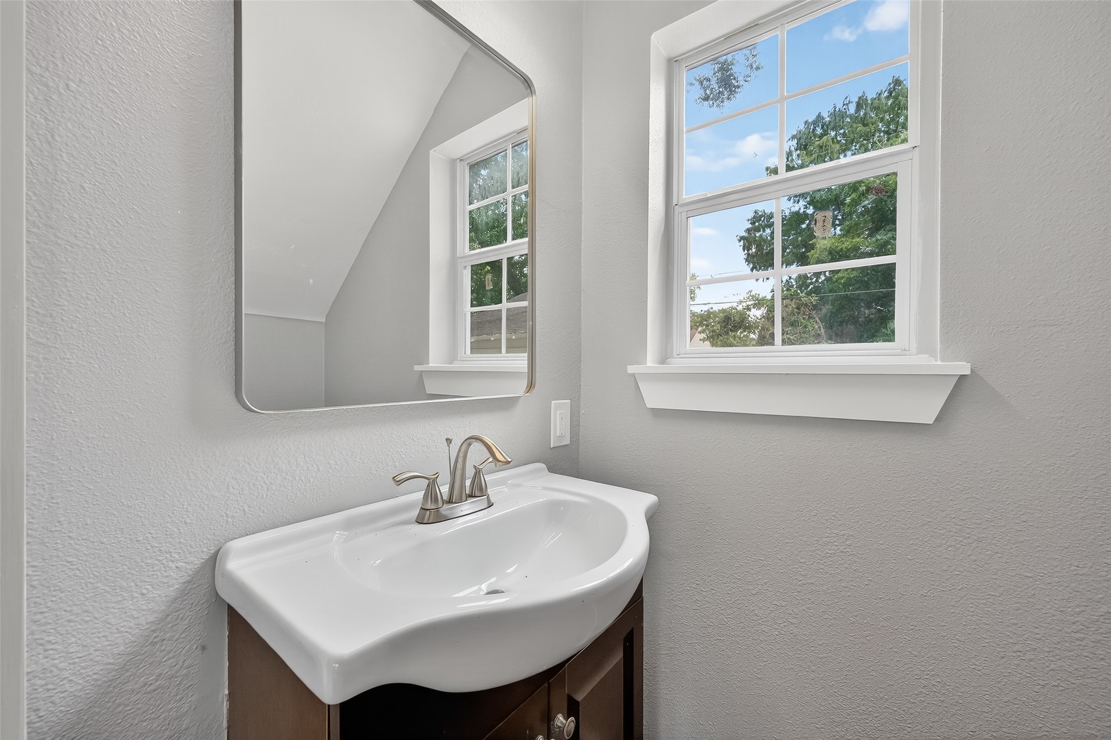 1933 Santa Rosa Street Houston, TX 77023 - Photo 37 of 44 a white sink sitting next to a white sink