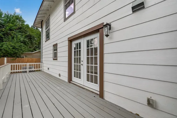 a view of deck with wooden floor and fence