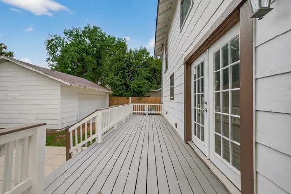 a view of balcony with deck and wooden floor