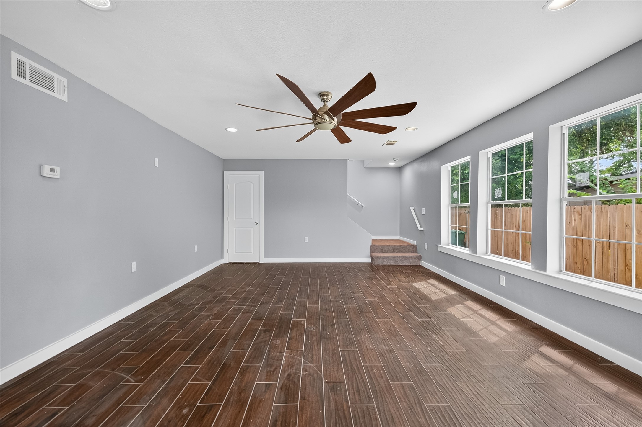 1933 Santa Rosa Street Houston, TX 77023 - Photo 9 of 44 a view of a livingroom with a ceiling fan and window