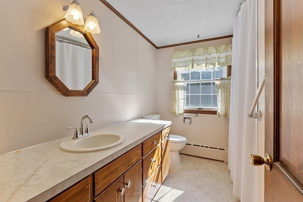 363 North Main Street Petersham, MA 01366 - Photo 13 of 32 a bathroom with a sink double vanity and a mirror
