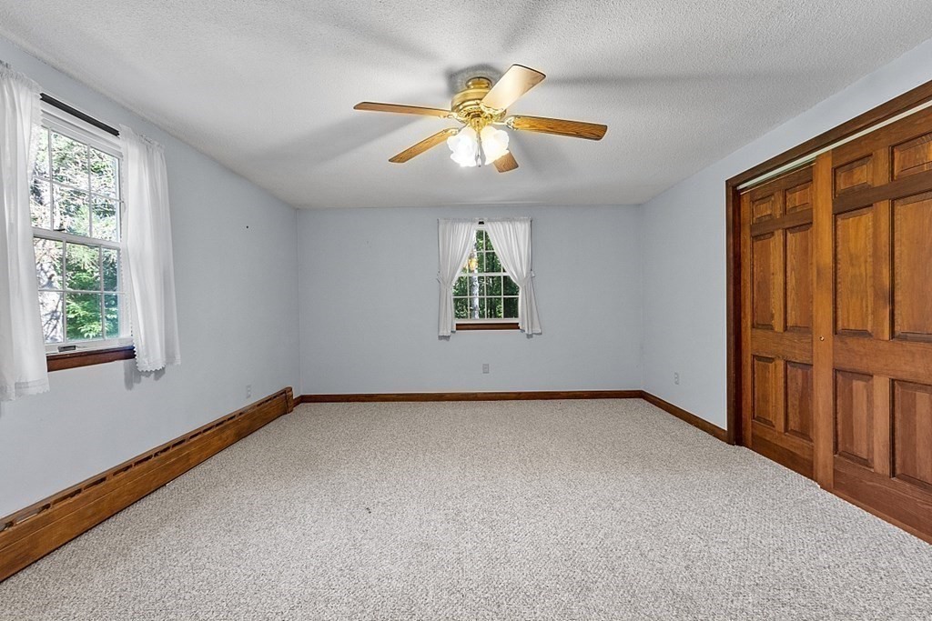 363 North Main Street Petersham, MA 01366 - Photo 15 of 32 an empty room with windows and fan