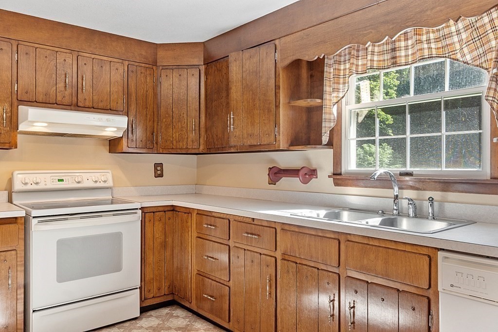 363 North Main Street Petersham, MA 01366 - Photo 9 of 32 a kitchen with stainless steel appliances granite countertop a sink a stove and cabinets