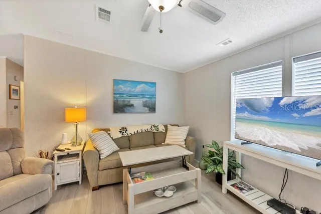 a bedroom with furniture and a potted plant