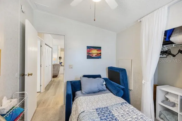 a bedroom with a bed and a couch