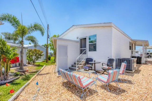 a view of a backyard with a patio