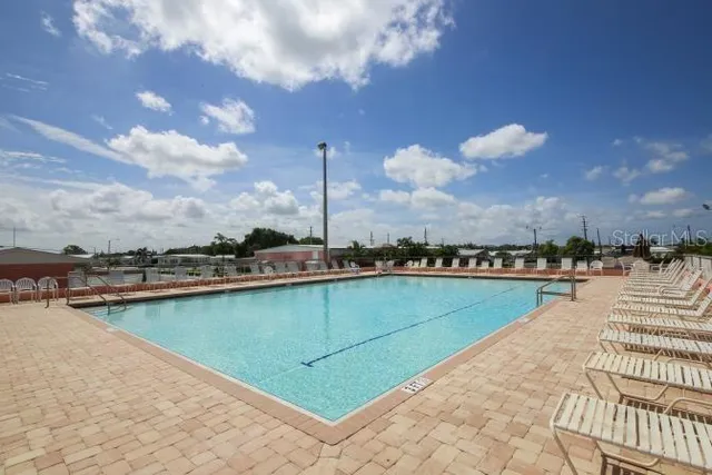 a view of a lake with sitting space