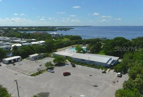 an aerial view of a house with yard