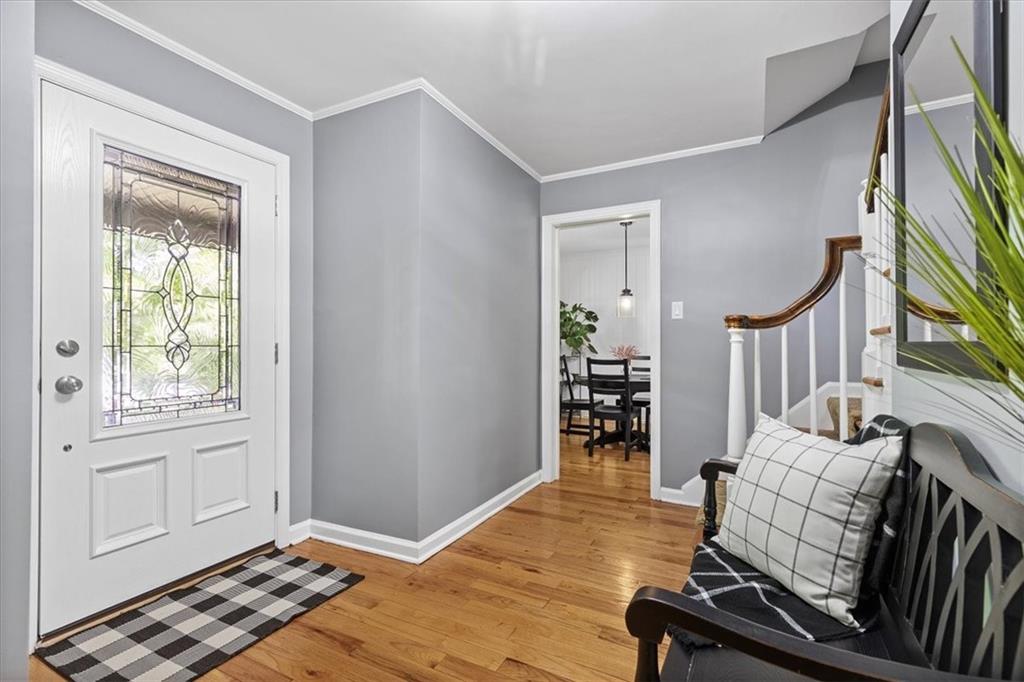 1385 Washington Road Pittsburgh, PA 15228 - Photo 6 of 46 Greet family and friends as they enter the front door in this beautiful entry with hardwood floors (Doorway noted in center of photo leads to the breakfast area and powder room)