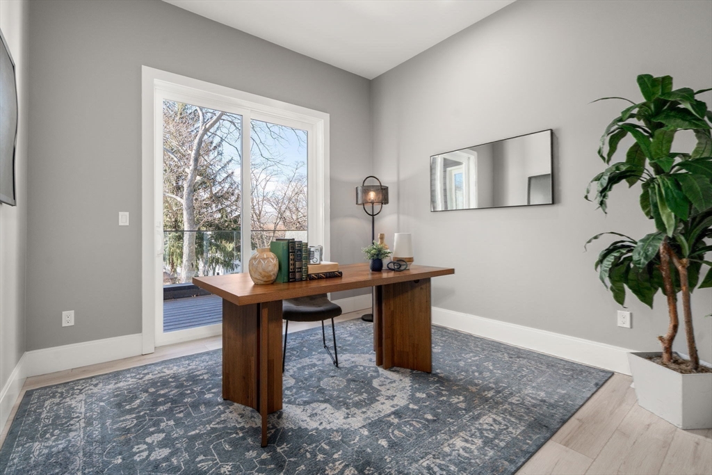 28 Wilson Circle, Unit 28 Newton, MA 02461 - Photo 13 of 14 a view of a workspace with furniture and a potted plant