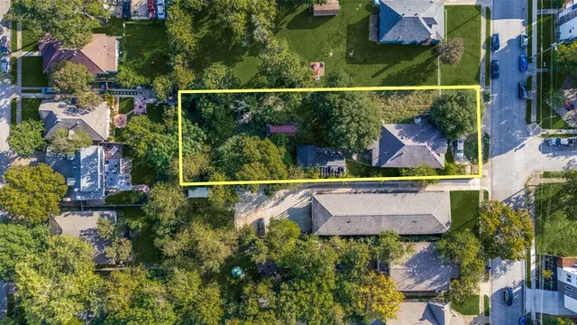an aerial view of house with a yard