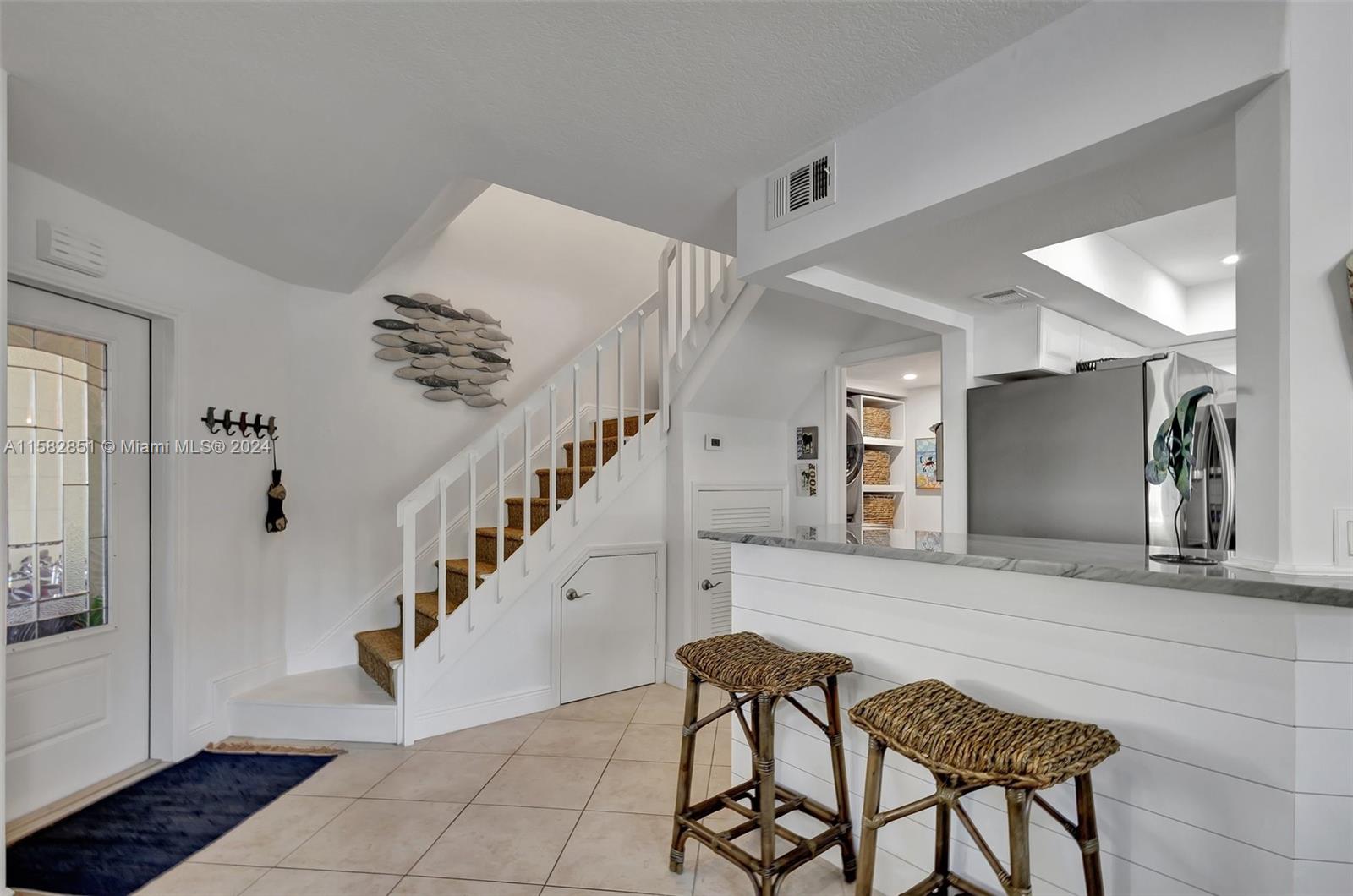 237 Seabreeze Circle Jupiter, FL 33477 - Photo 28 of 63 a view of a hallway with seating area and entryway
