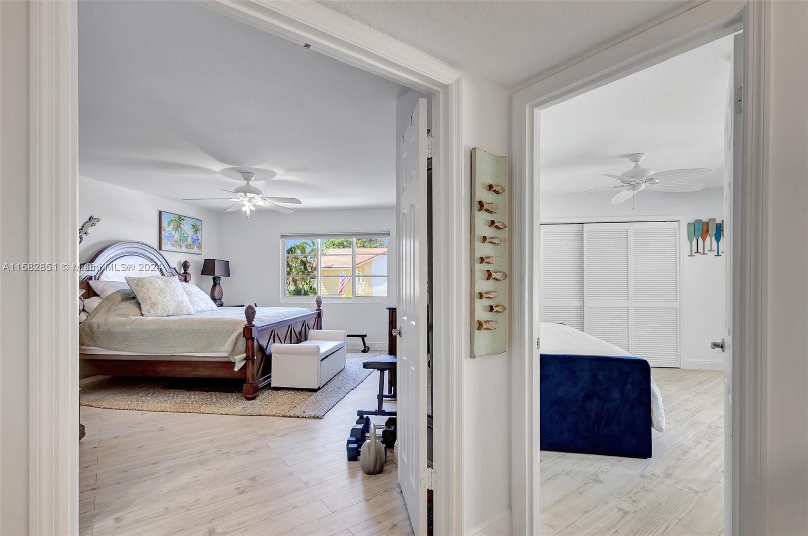 237 Seabreeze Circle Jupiter, FL 33477 - Photo 30 of 63 a bedroom with furniture and a window