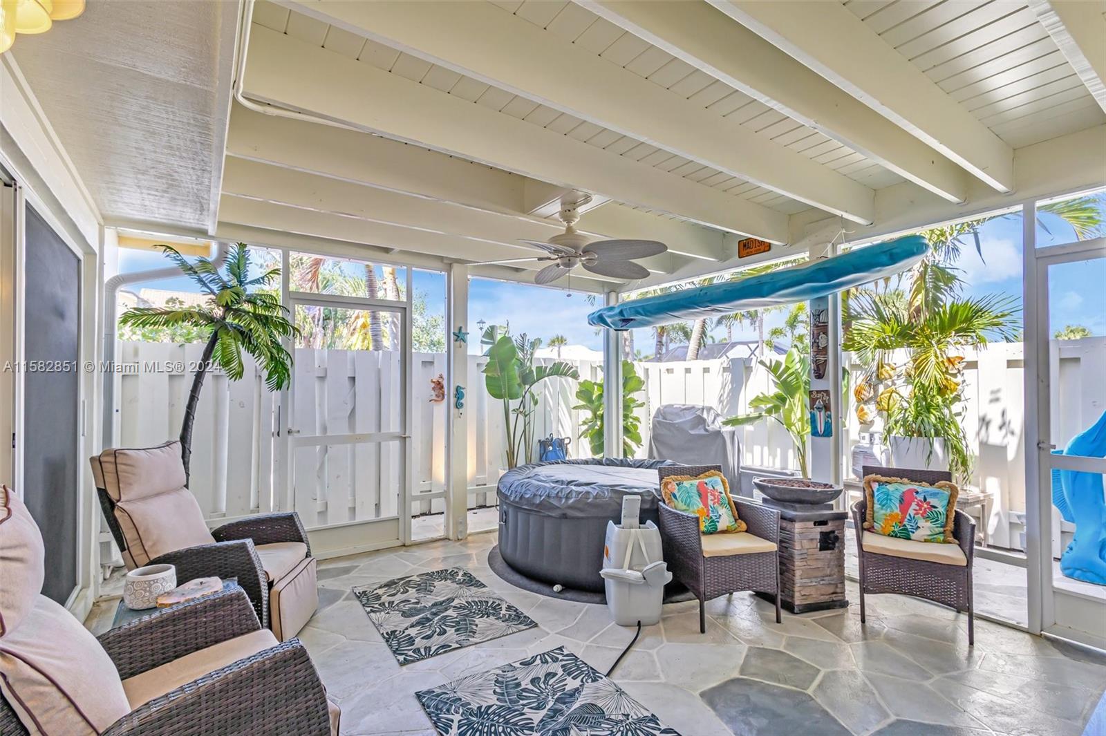 237 Seabreeze Circle Jupiter, FL 33477 - Photo 3 of 63 a living room with furniture and a floor to ceiling window