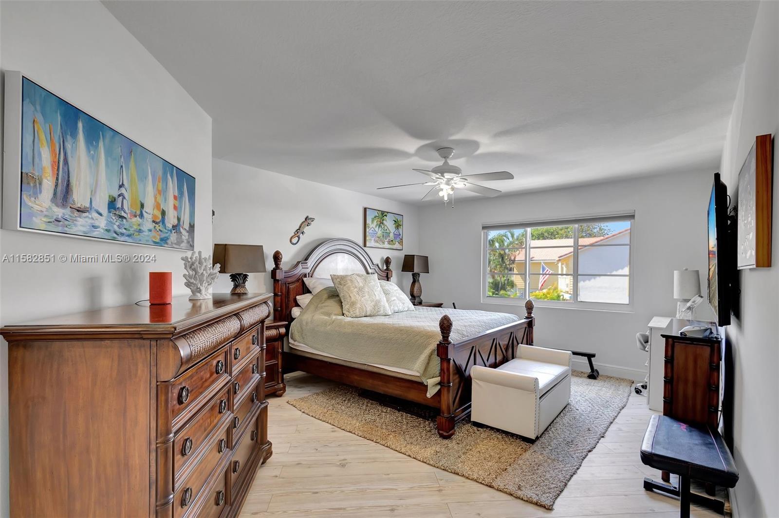 237 Seabreeze Circle Jupiter, FL 33477 - Photo 31 of 63 a bedroom with furniture and a window