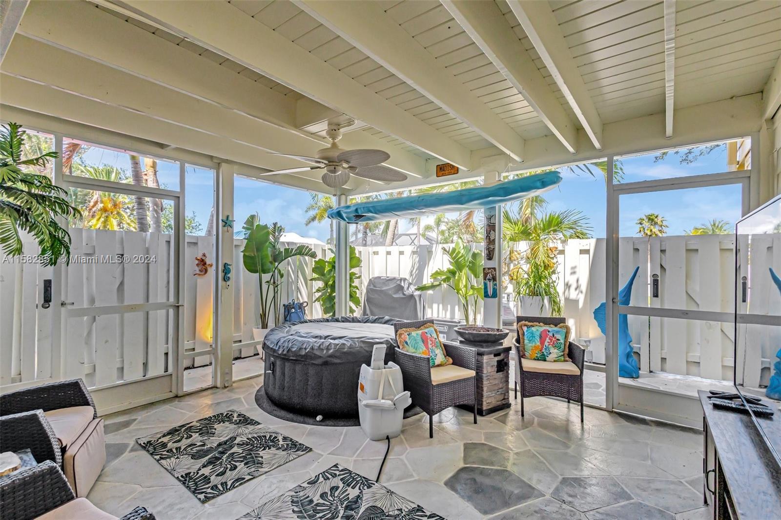 237 Seabreeze Circle Jupiter, FL 33477 - Photo 4 of 63 a living room with furniture and a large window