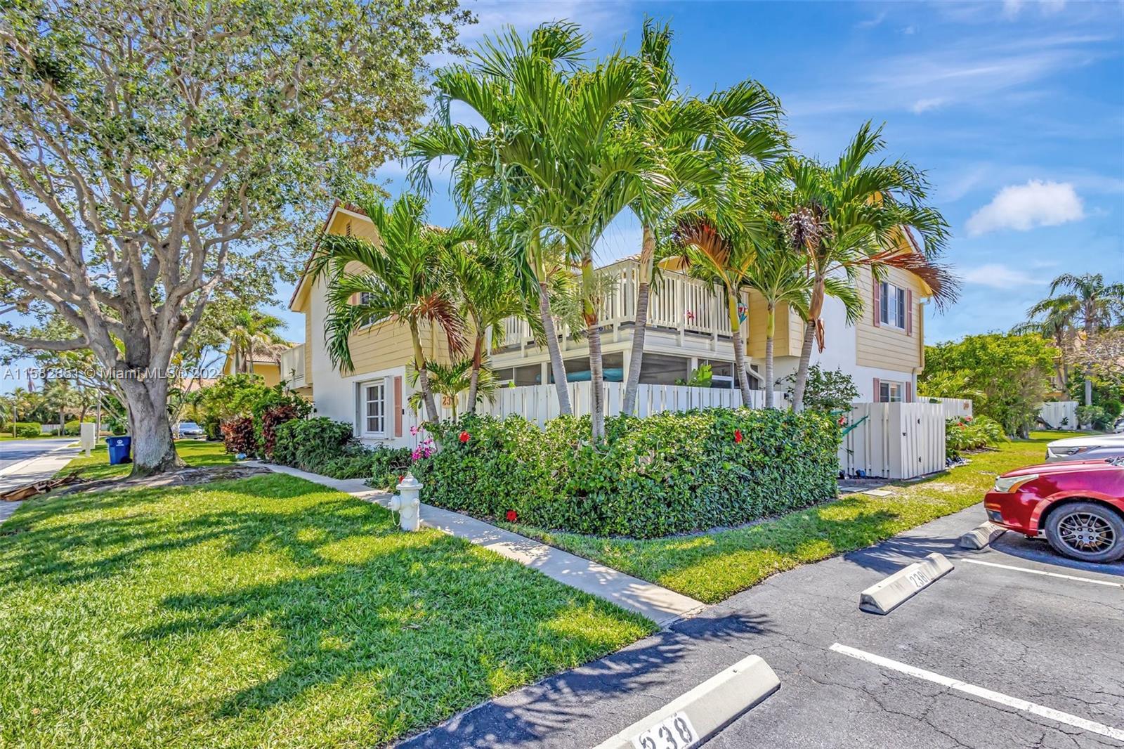 237 Seabreeze Circle Jupiter, FL 33477 - Photo 50 of 63 a front view of a house with garden