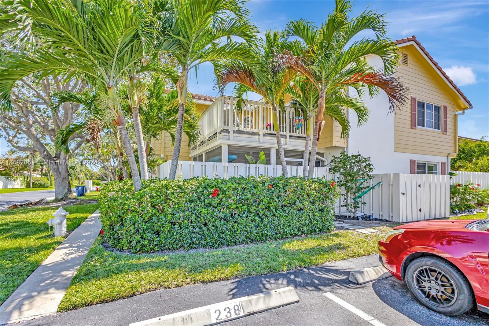 237 Seabreeze Circle Jupiter, FL 33477 - Photo 51 of 63 a front view of a house with garden