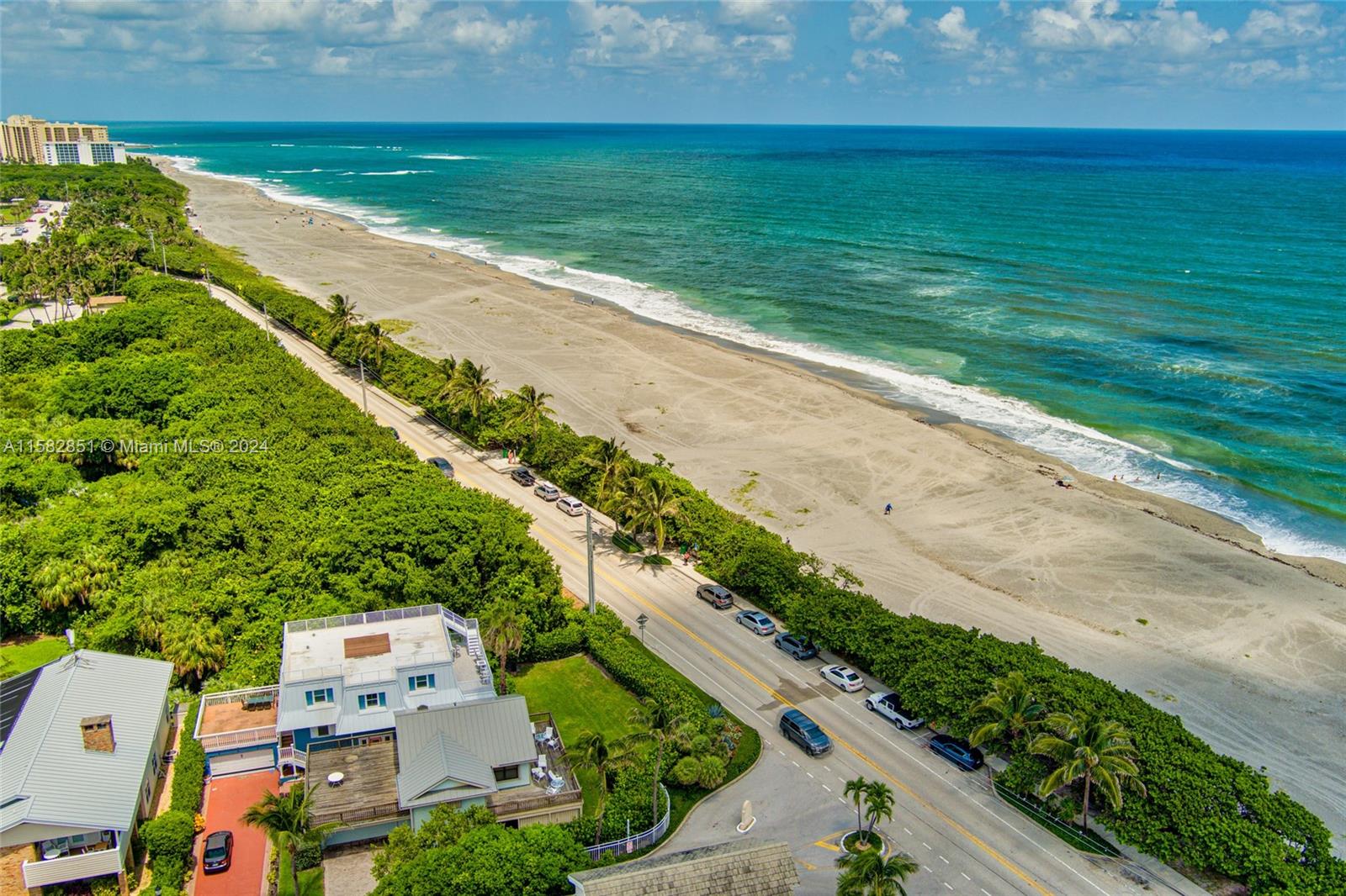 237 Seabreeze Circle Jupiter, FL 33477 - Photo 58 of 63 a view of an ocean view and a yard