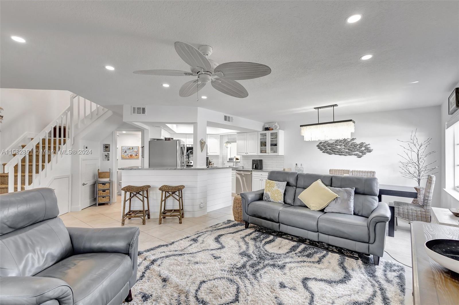 237 Seabreeze Circle Jupiter, FL 33477 - Photo 10 of 63 a living room with furniture and a large window