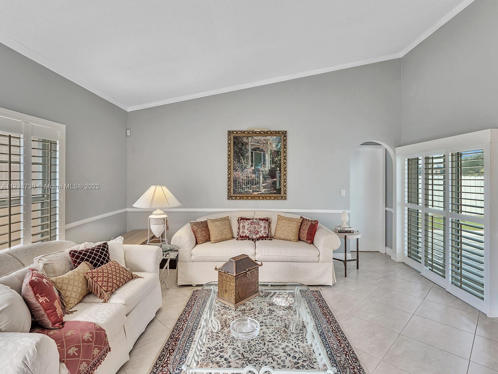 11291 Southwest 62nd Terrace Miami, FL 33173 - Photo 11 of 65 a living room with furniture and a large window