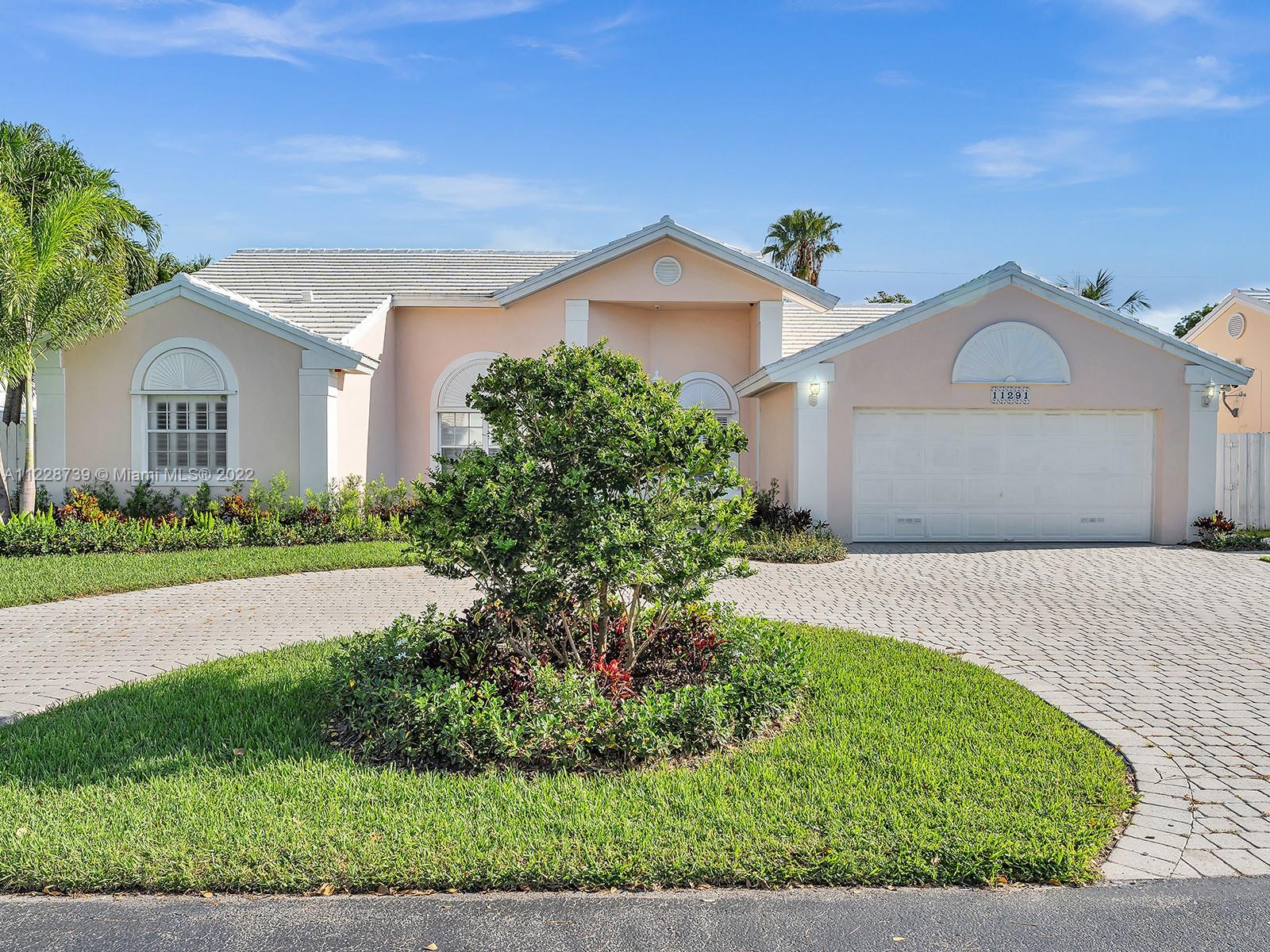 11291 Southwest 62nd Terrace Miami, FL 33173 - Photo 17 of 65 a front view of a house with garden