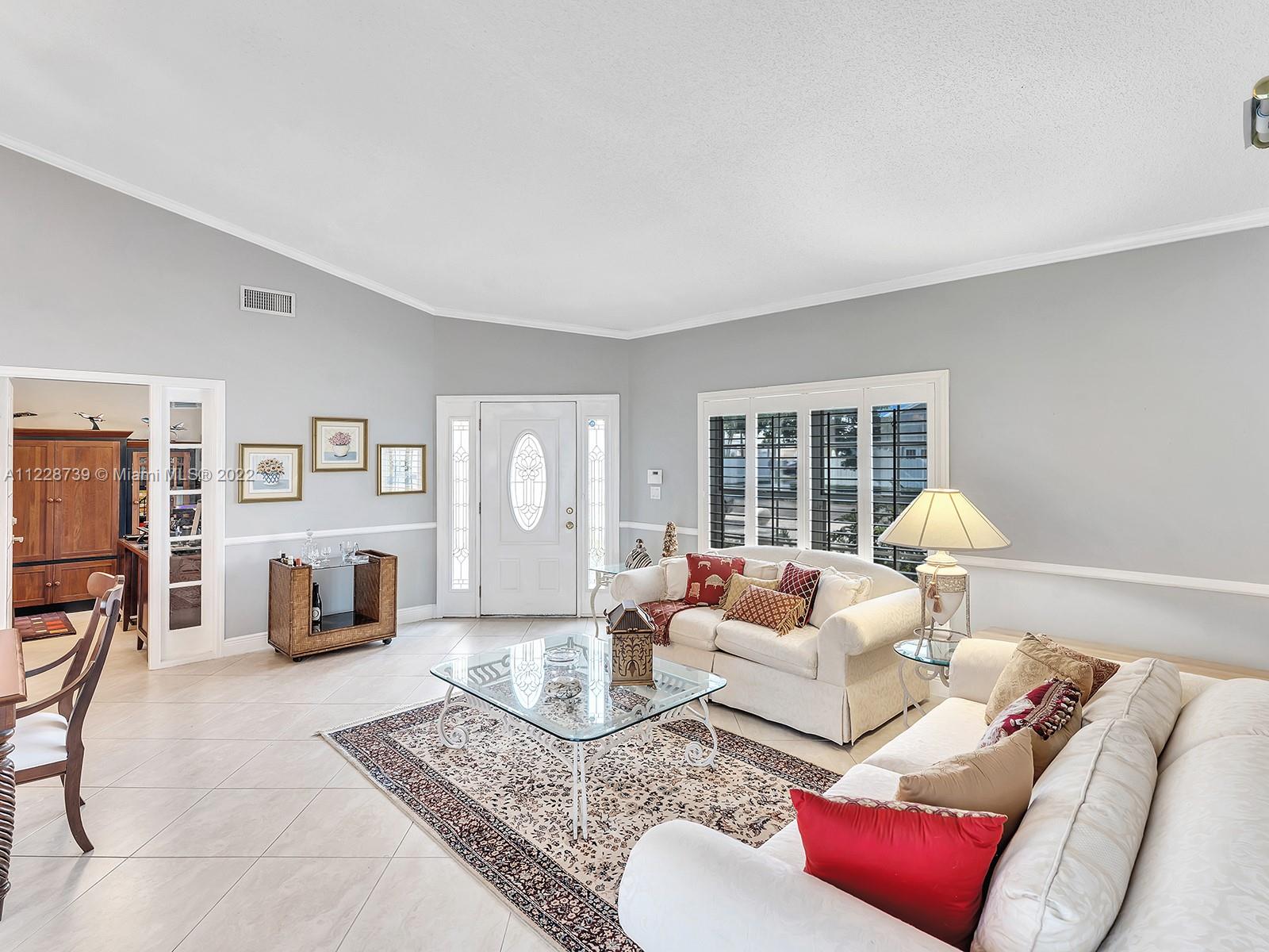 11291 Southwest 62nd Terrace Miami, FL 33173 - Photo 18 of 65 a living room with furniture and a table