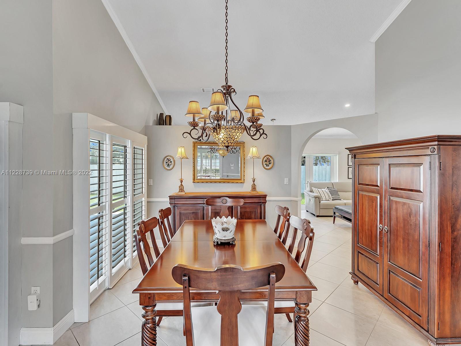 11291 Southwest 62nd Terrace Miami, FL 33173 - Photo 19 of 65 a view of a a dining room with furniture window and wooden floor