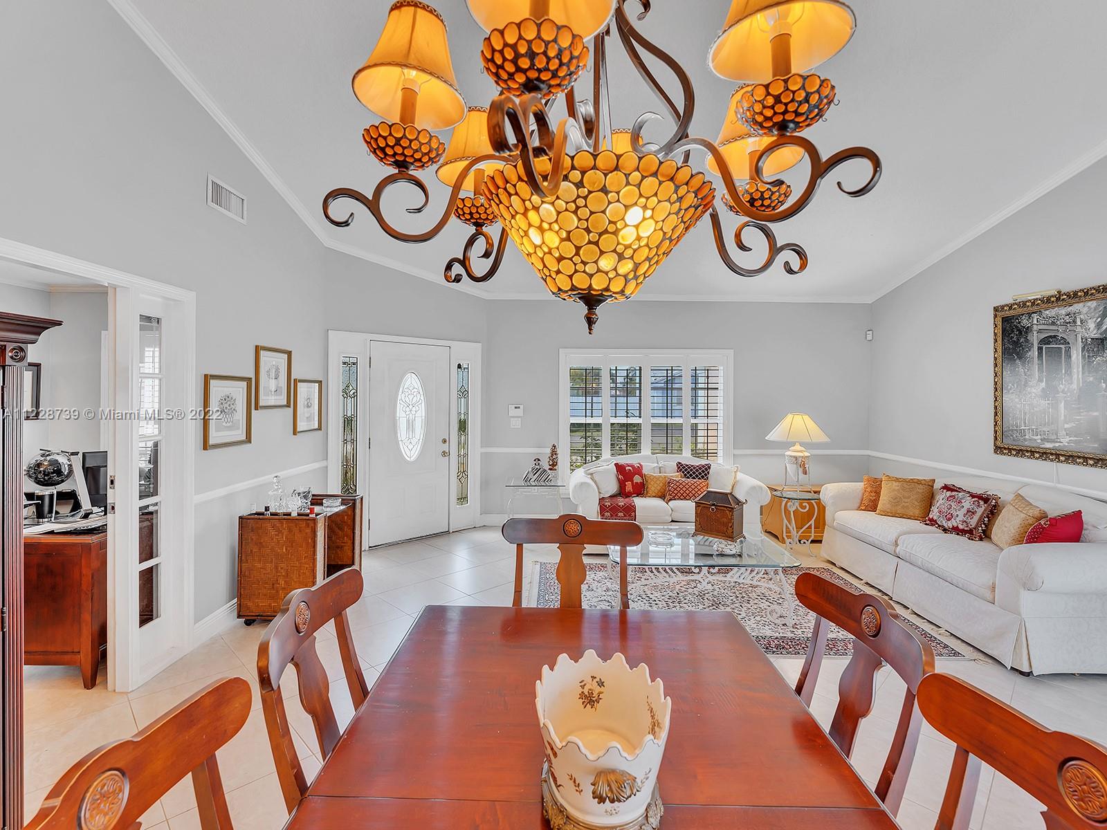 11291 Southwest 62nd Terrace Miami, FL 33173 - Photo 22 of 65 a living room with furniture and a table