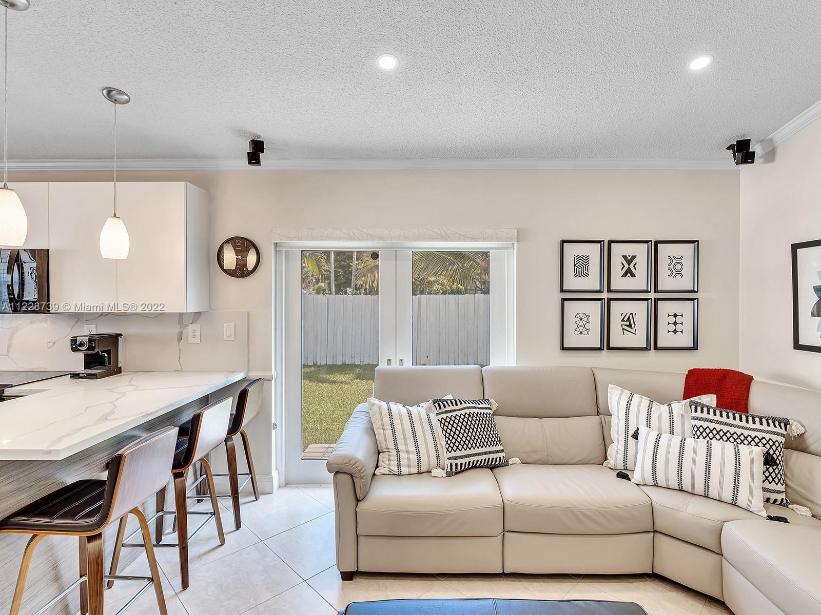 11291 Southwest 62nd Terrace Miami, FL 33173 - Photo 26 of 65 a living room with a couch and a wooden floor
