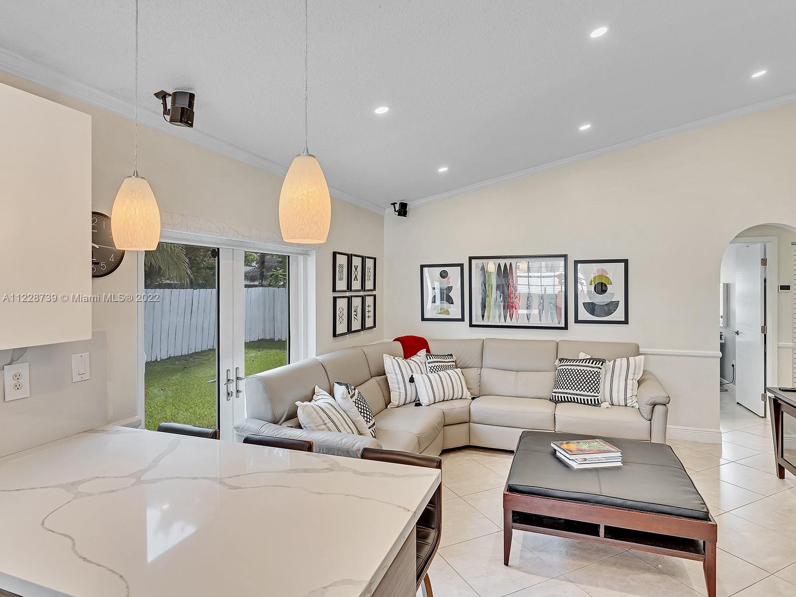 11291 Southwest 62nd Terrace Miami, FL 33173 - Photo 35 of 65 a living room with furniture and a table