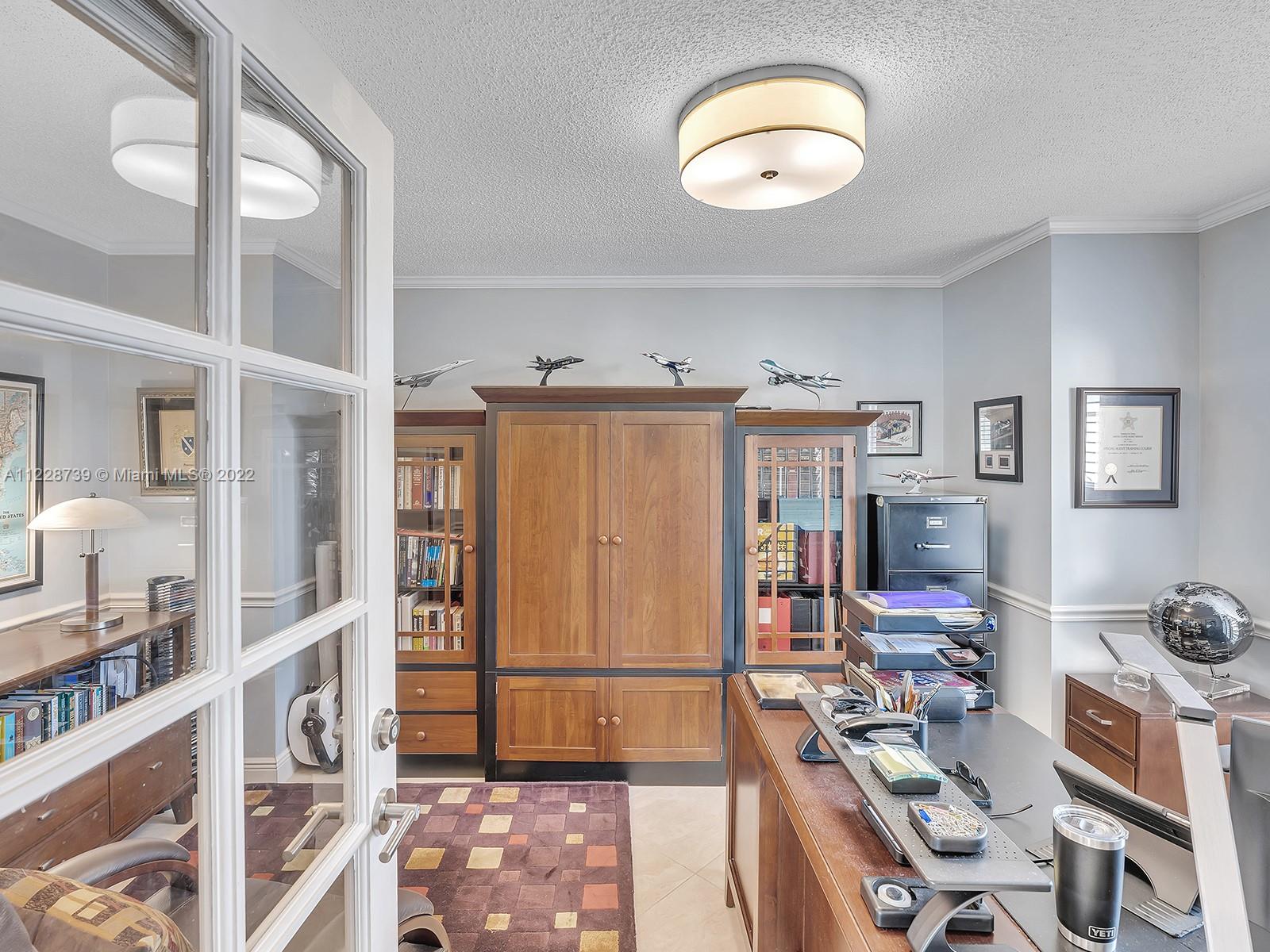 11291 Southwest 62nd Terrace Miami, FL 33173 - Photo 42 of 65 a view of a bedroom with workspace and a window