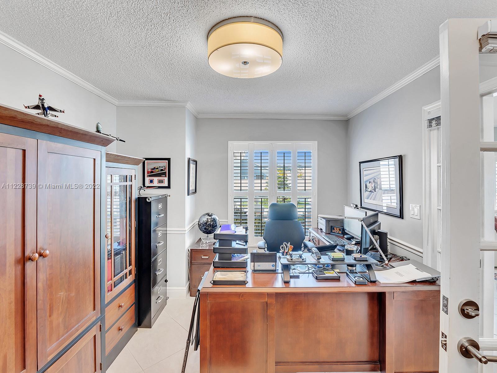 11291 Southwest 62nd Terrace Miami, FL 33173 - Photo 43 of 65 a view of a kitchen with dining table and chairs