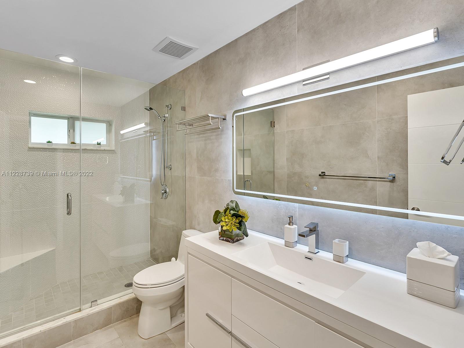 11291 Southwest 62nd Terrace Miami, FL 33173 - Photo 46 of 65 a bathroom with a sink a toilet and shower