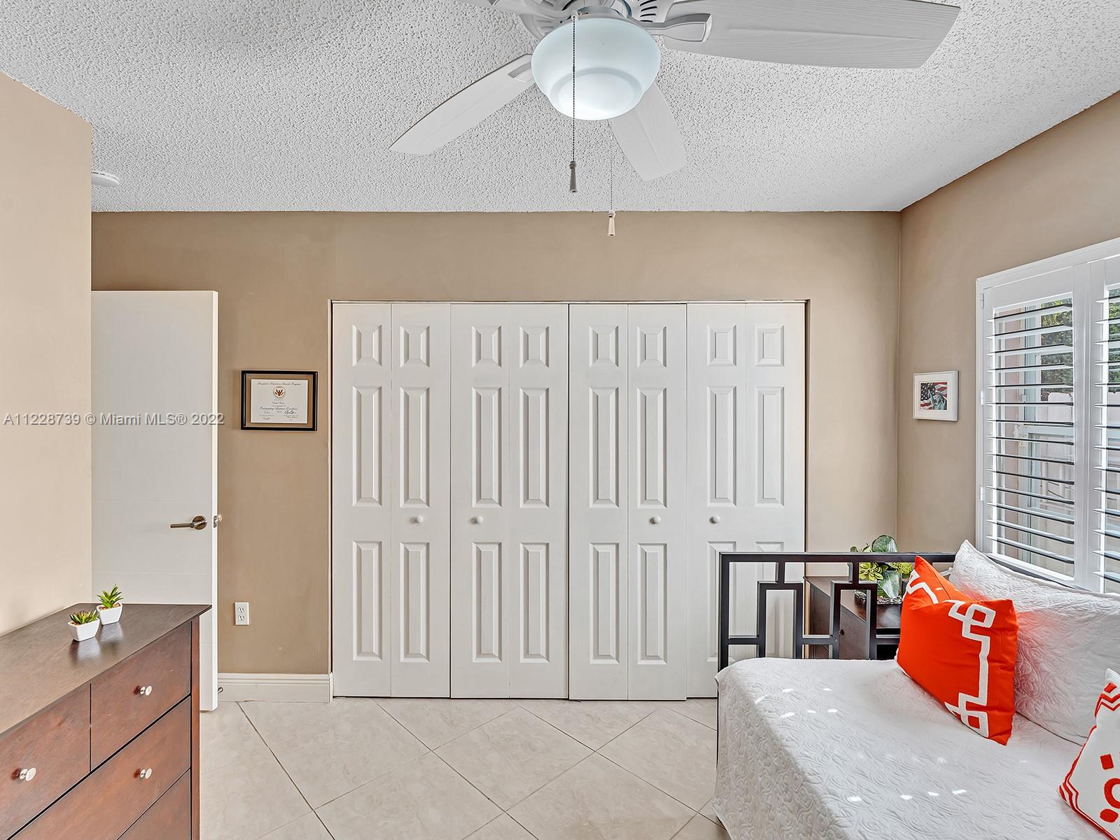 11291 Southwest 62nd Terrace Miami, FL 33173 - Photo 51 of 65 a spacious bedroom with a bed and window