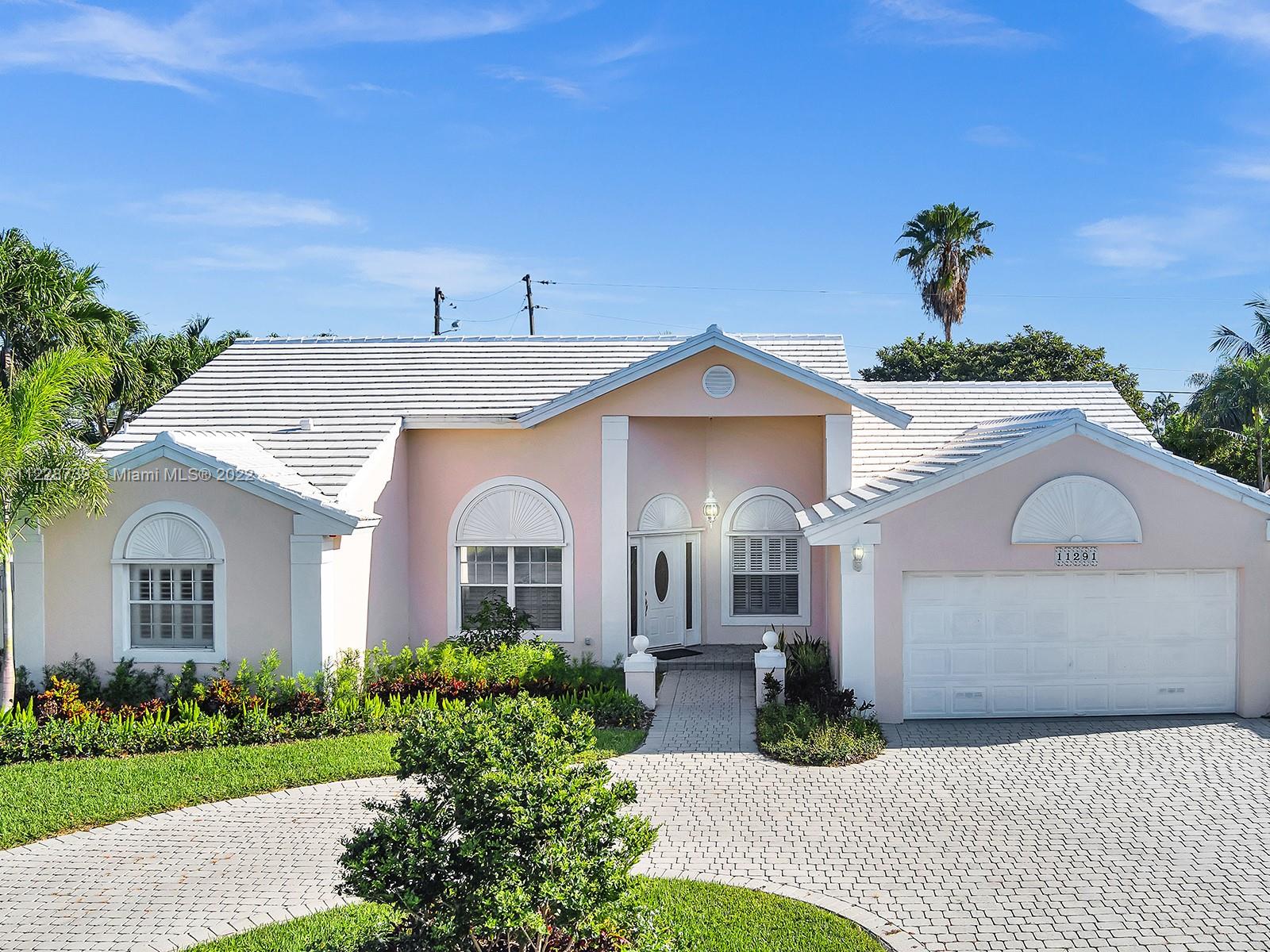11291 Southwest 62nd Terrace Miami, FL 33173 - Photo 57 of 65 a front view of a house with garden