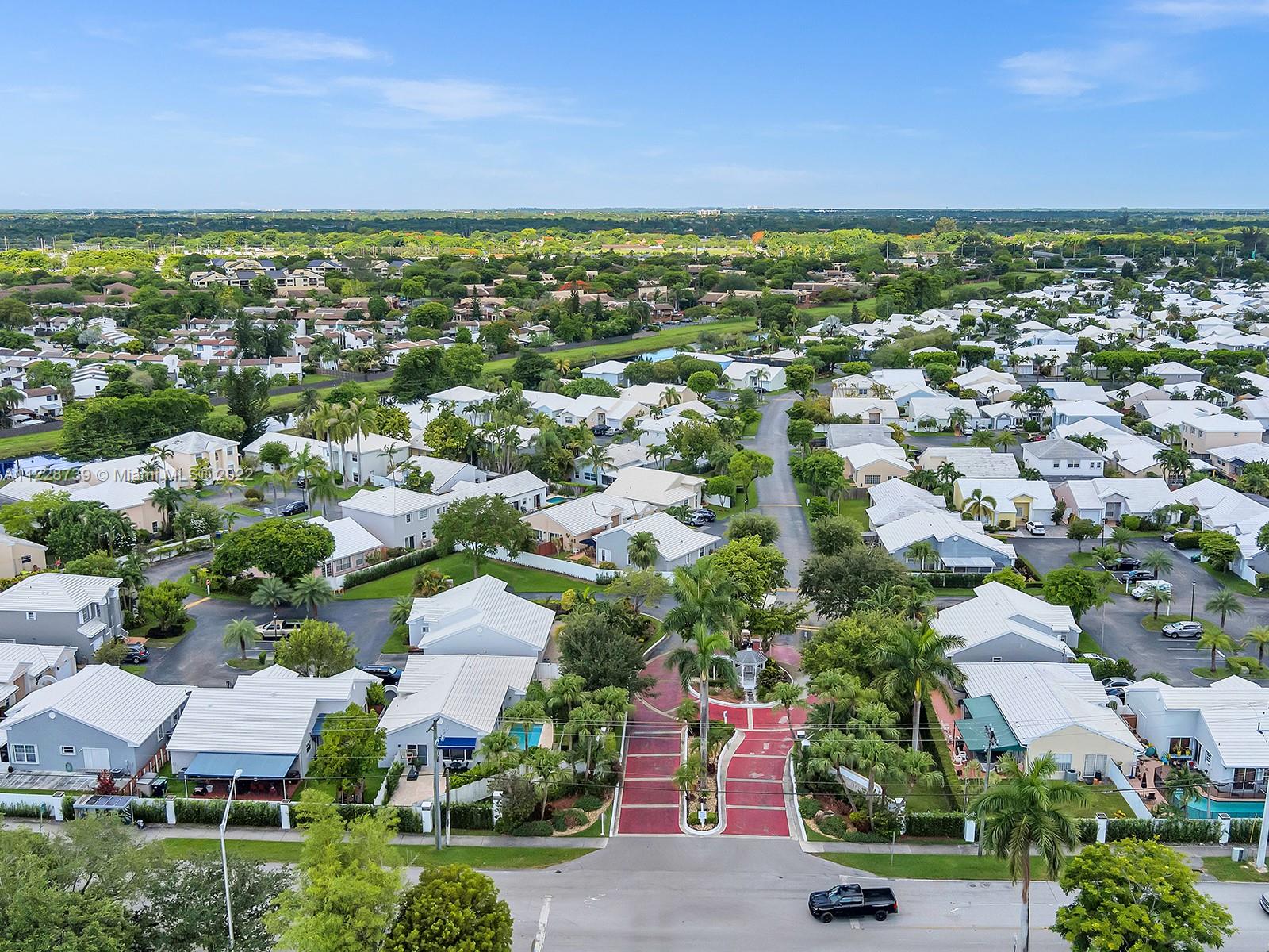 11291 Southwest 62nd Terrace Miami, FL 33173 - Photo 63 of 65 an aerial view of residential houses with outdoor space and trees