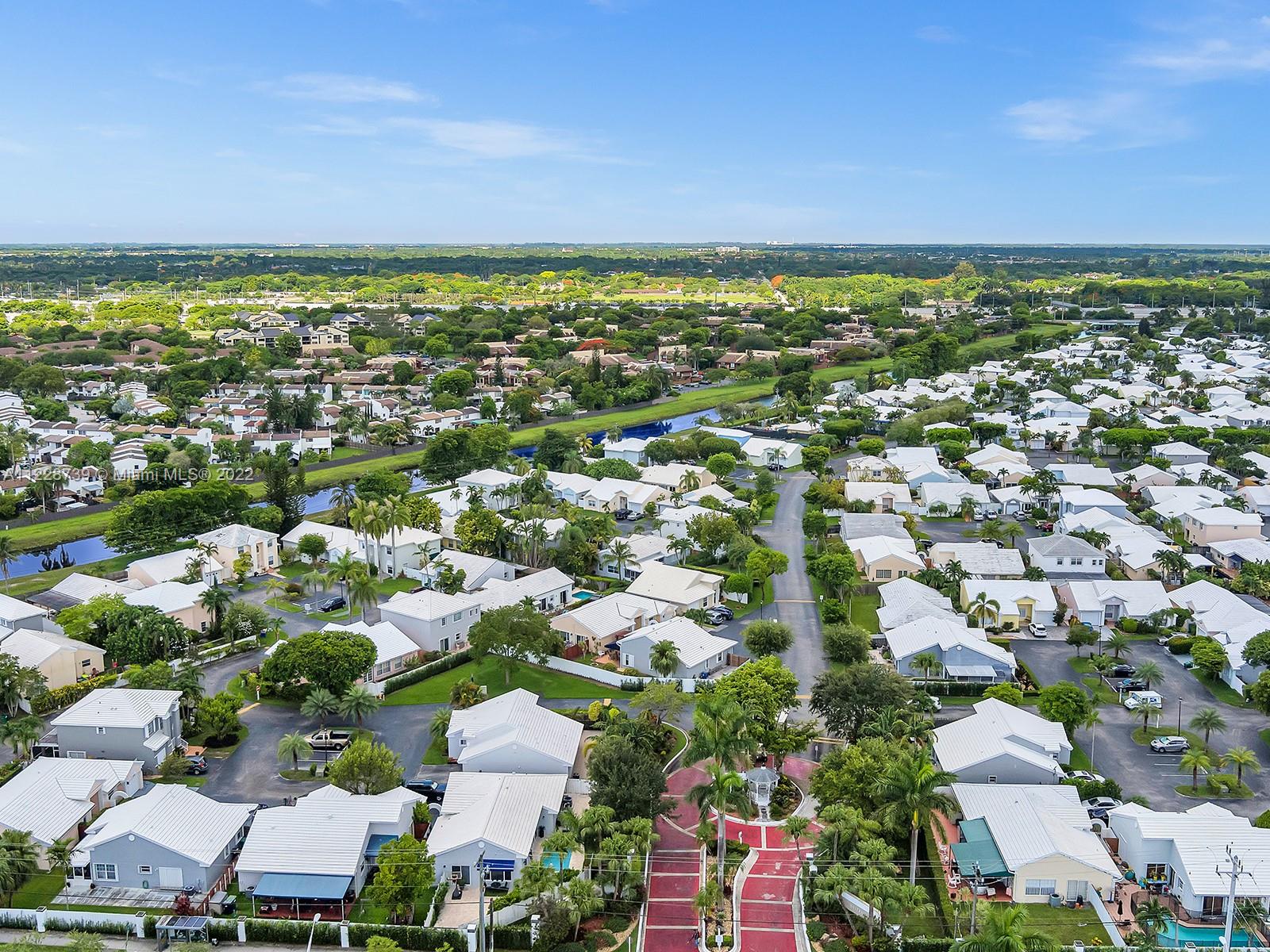 11291 Southwest 62nd Terrace Miami, FL 33173 - Photo 64 of 65 an aerial view of residential houses with outdoor space and trees