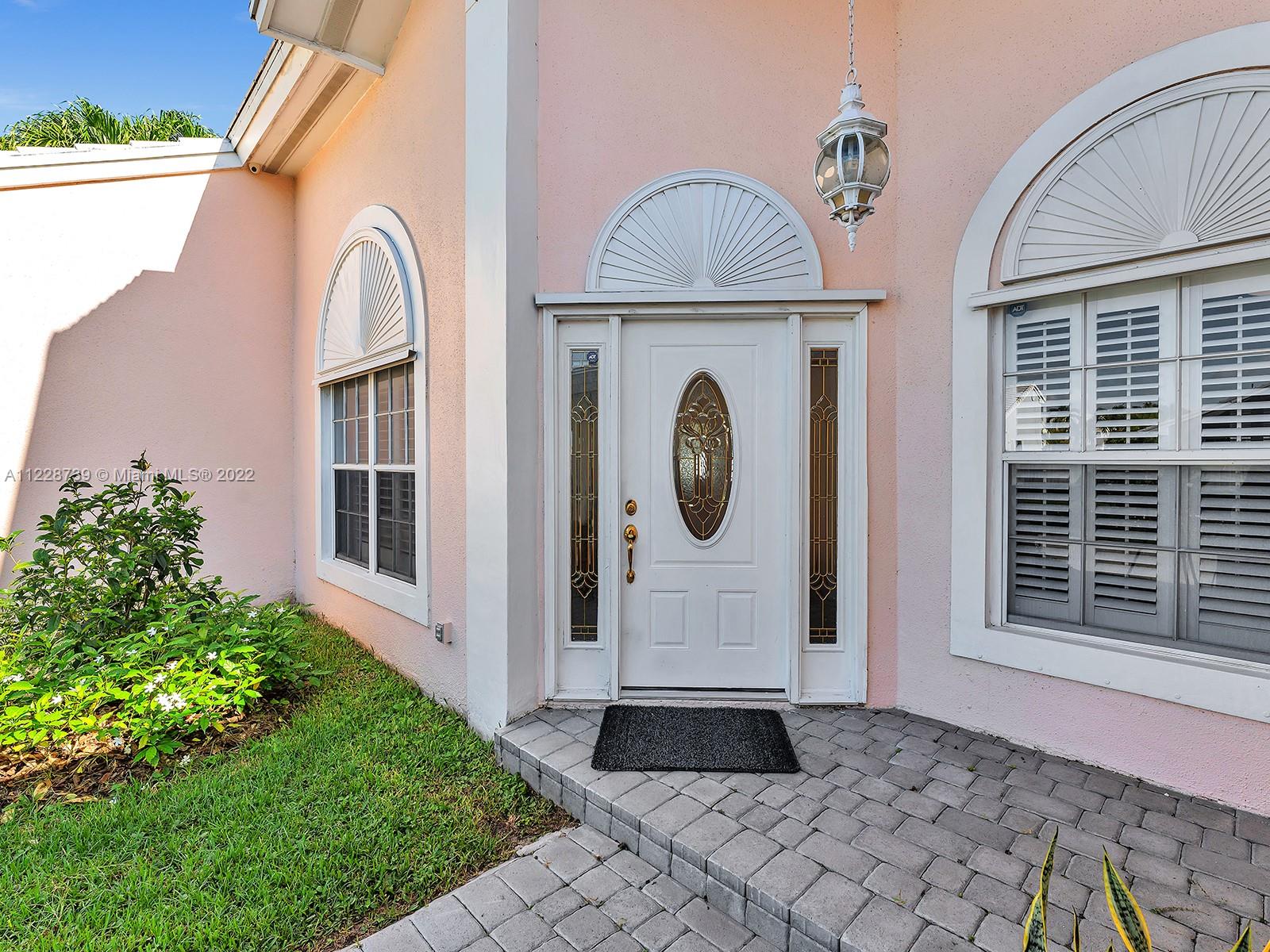11291 Southwest 62nd Terrace Miami, FL 33173 - Photo 9 of 65 a front view of a house with a garden