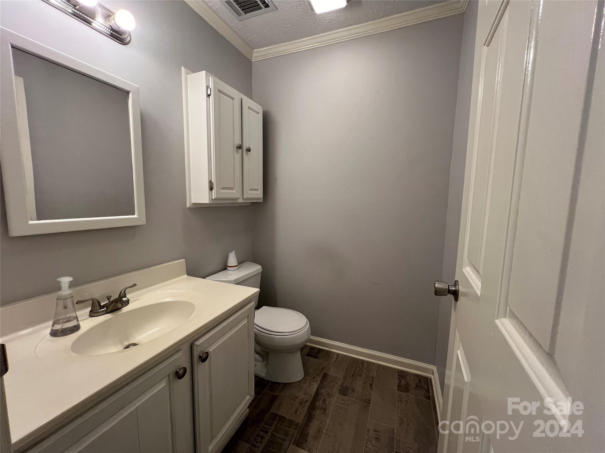 148 Riff Drive Forest City, NC 28043 - Photo 11 of 40 a bathroom with a sink and a toilet