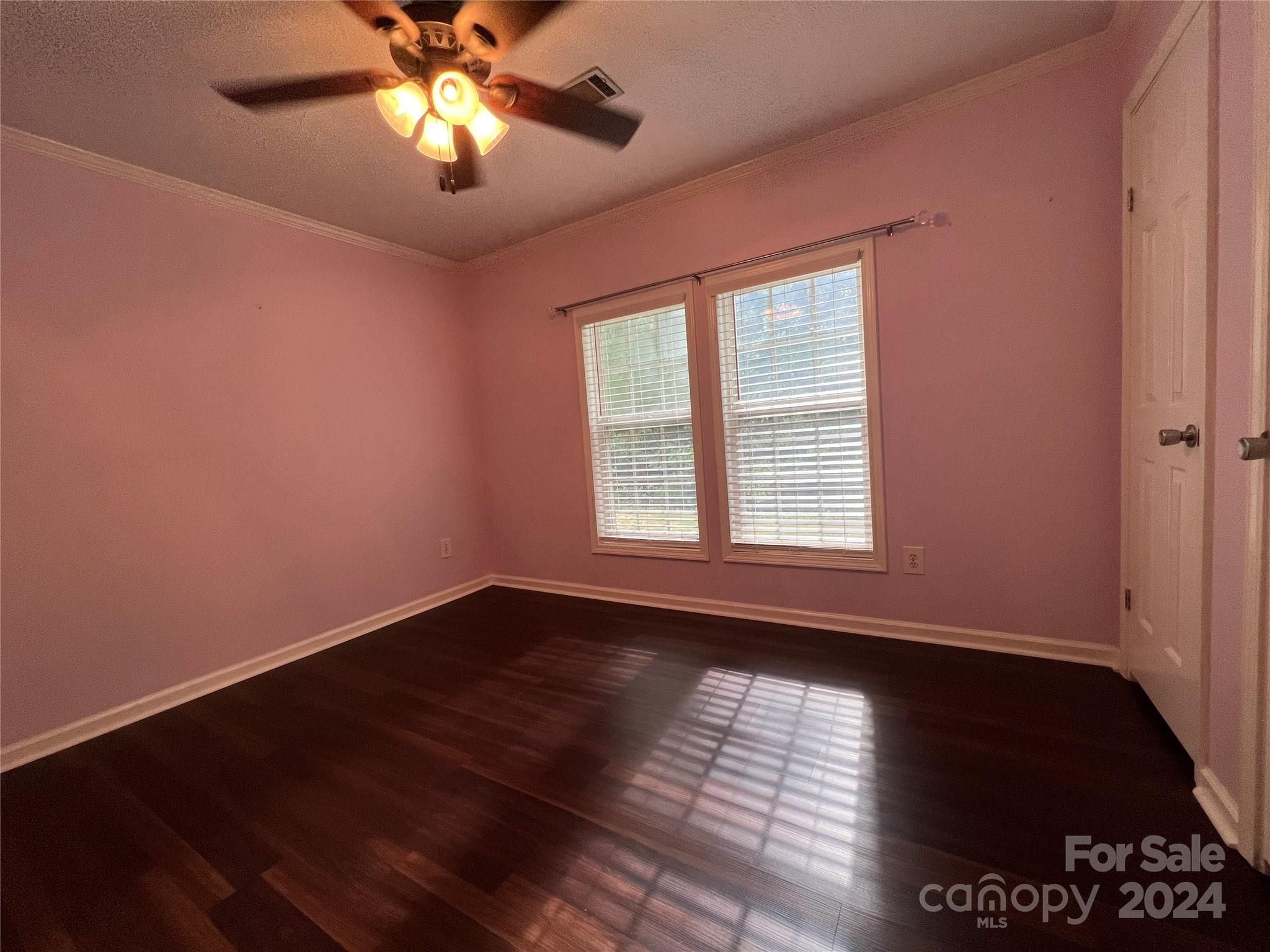 148 Riff Drive Forest City, NC 28043 - Photo 12 of 40 a view of empty room with wooden floor and fan