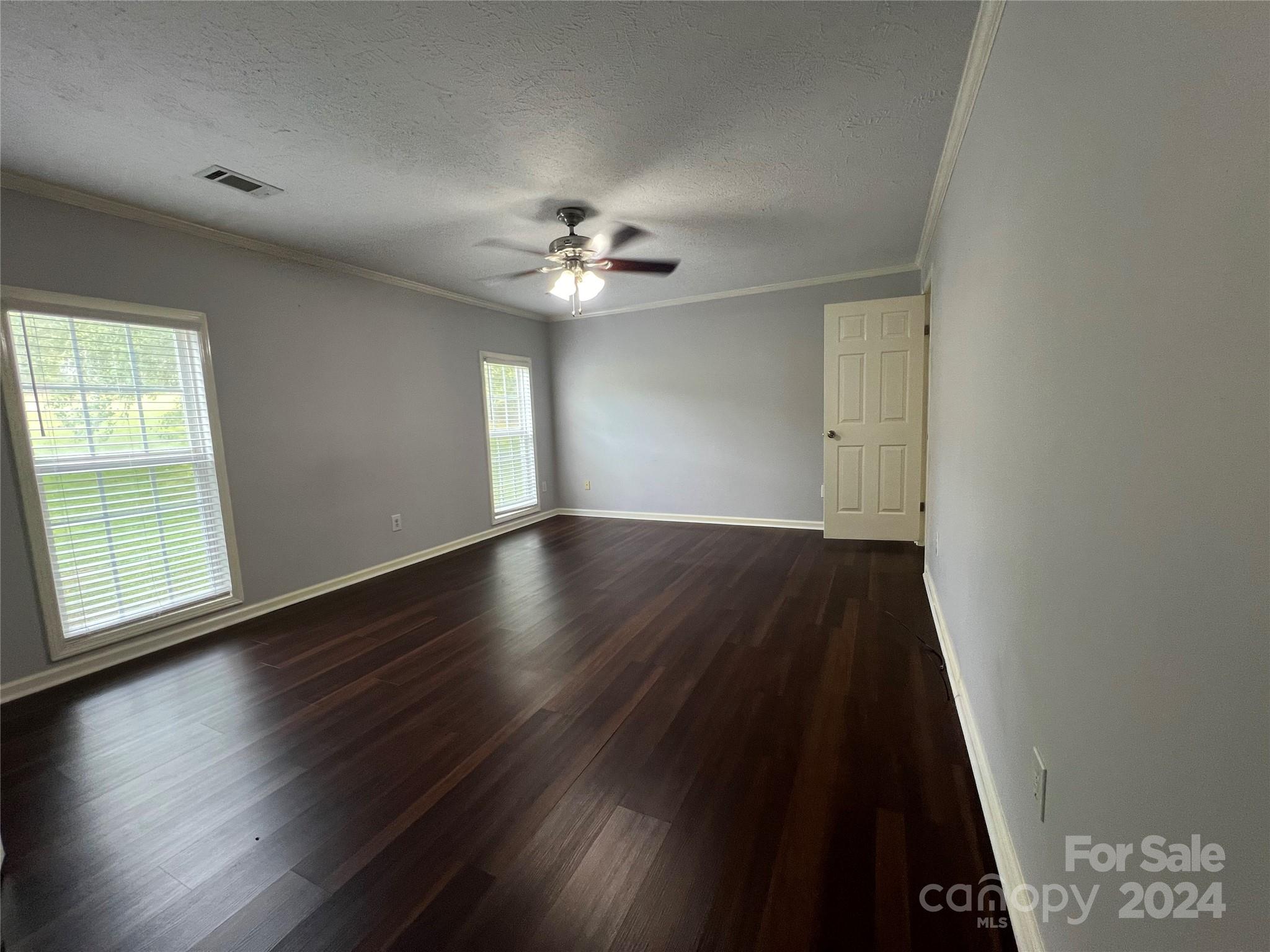 148 Riff Drive Forest City, NC 28043 - Photo 15 of 40 an empty room with wooden floor and windows