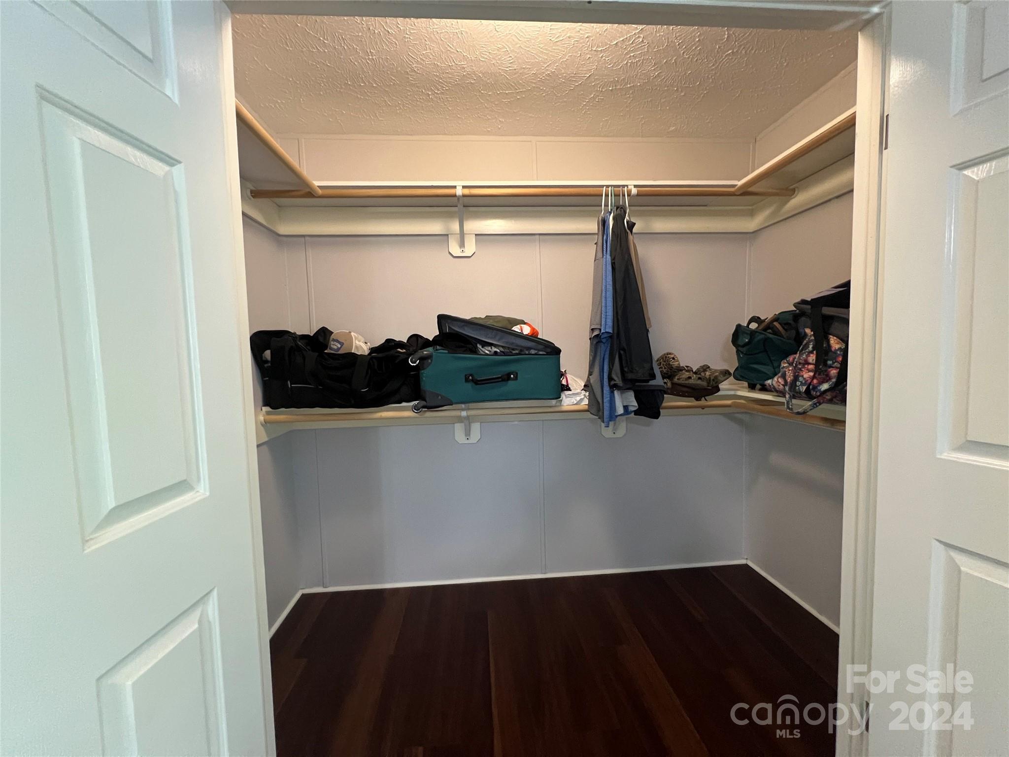 148 Riff Drive Forest City, NC 28043 - Photo 16 of 40 a view of walk in closet with clothes and shoes