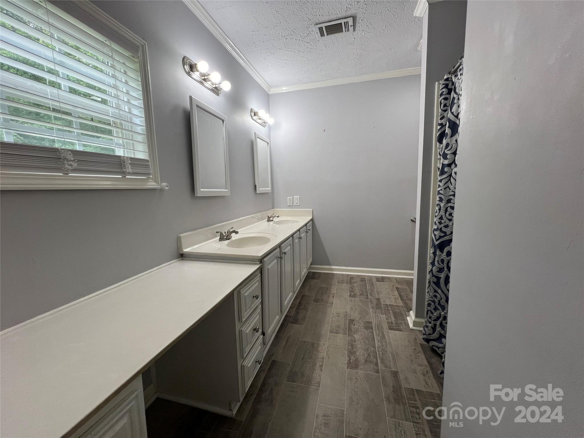148 Riff Drive Forest City, NC 28043 - Photo 17 of 40 a bathroom with a sink a mirror and a shower