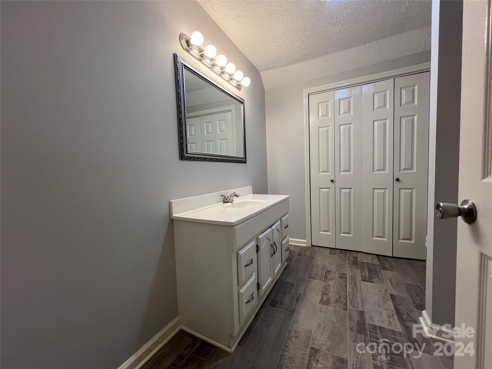 148 Riff Drive Forest City, NC 28043 - Photo 22 of 40 a view of a bathroom with sink and mirror